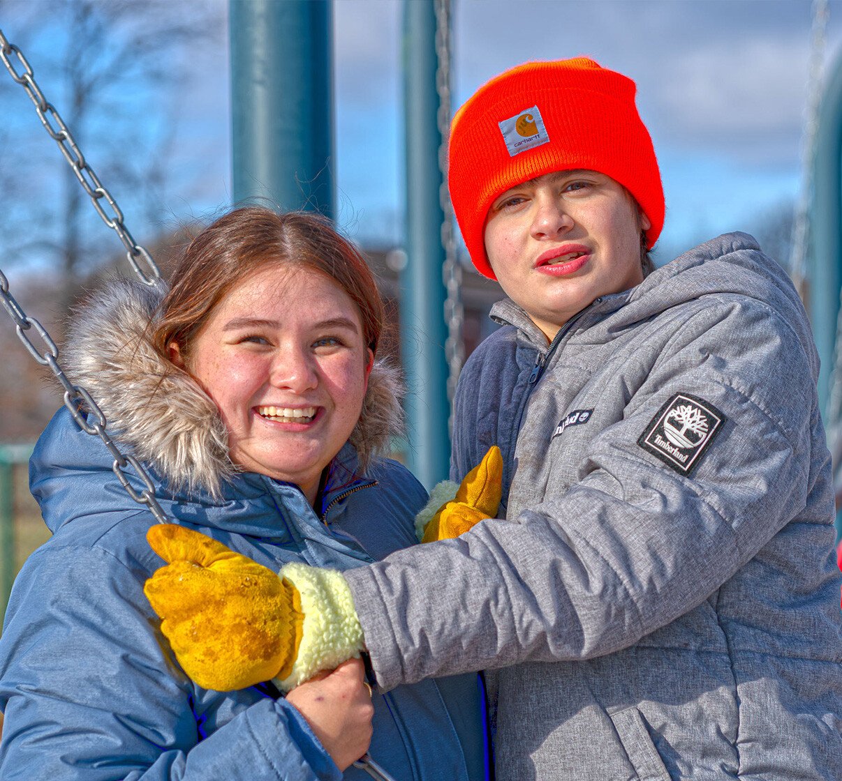 staff with client on swing set